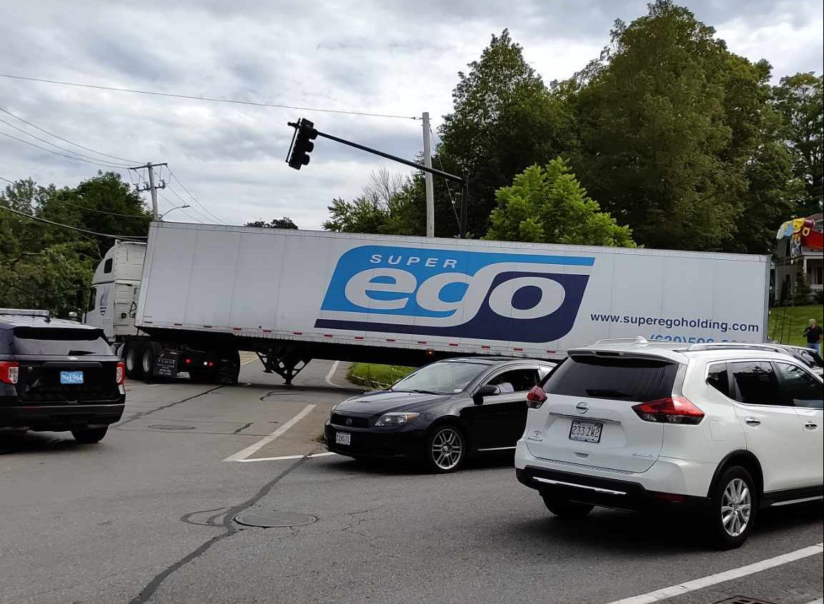Tractor-trailer gets stuck as it makes a turn on Central & Willard Street in Leominster