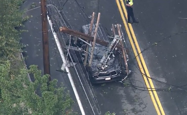 Car crushed by utility pole during thunderstorm in Acton