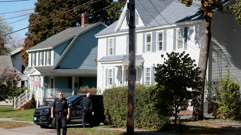 Police outside of the Penningtons' home located at 42 Cherry Street in Gardner. (Courtesy Photo/Jessica Rinaldi of the Boston Globe)