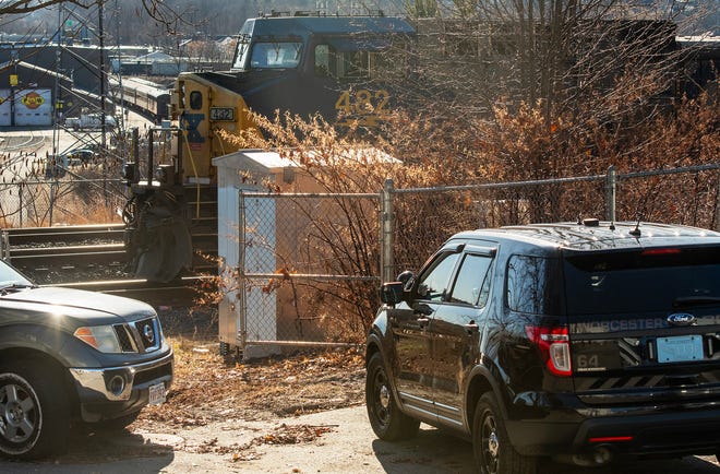 Police investigate a train incident on tracks at the end of Oread Street Wednesday. (Rick Cinclair/Telegram & Gazette)
