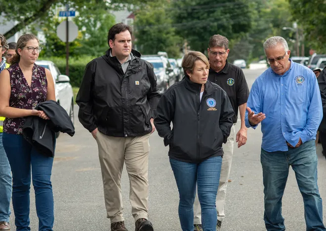 Leominster Mayor Dean Mazzarella (far right) speaks with Gov. Maura Healey while surveying damage from last September's flooding with Sen. John Cronin (second from left) and State Rep. Natalie Higgin (far left). (Courtesy Photo: Rick Cinclair/Telegram & Gazette)