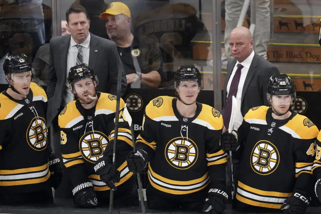 Bruins head coach Jim Montgomery, right, and associate coach Joe Sacco, left, during a game on Nov. 18, 2024. The team announced Montgomery’s firing the next day, with Sacco named interim coach. (Photo Credit: AP Photo/Charles Krupa)