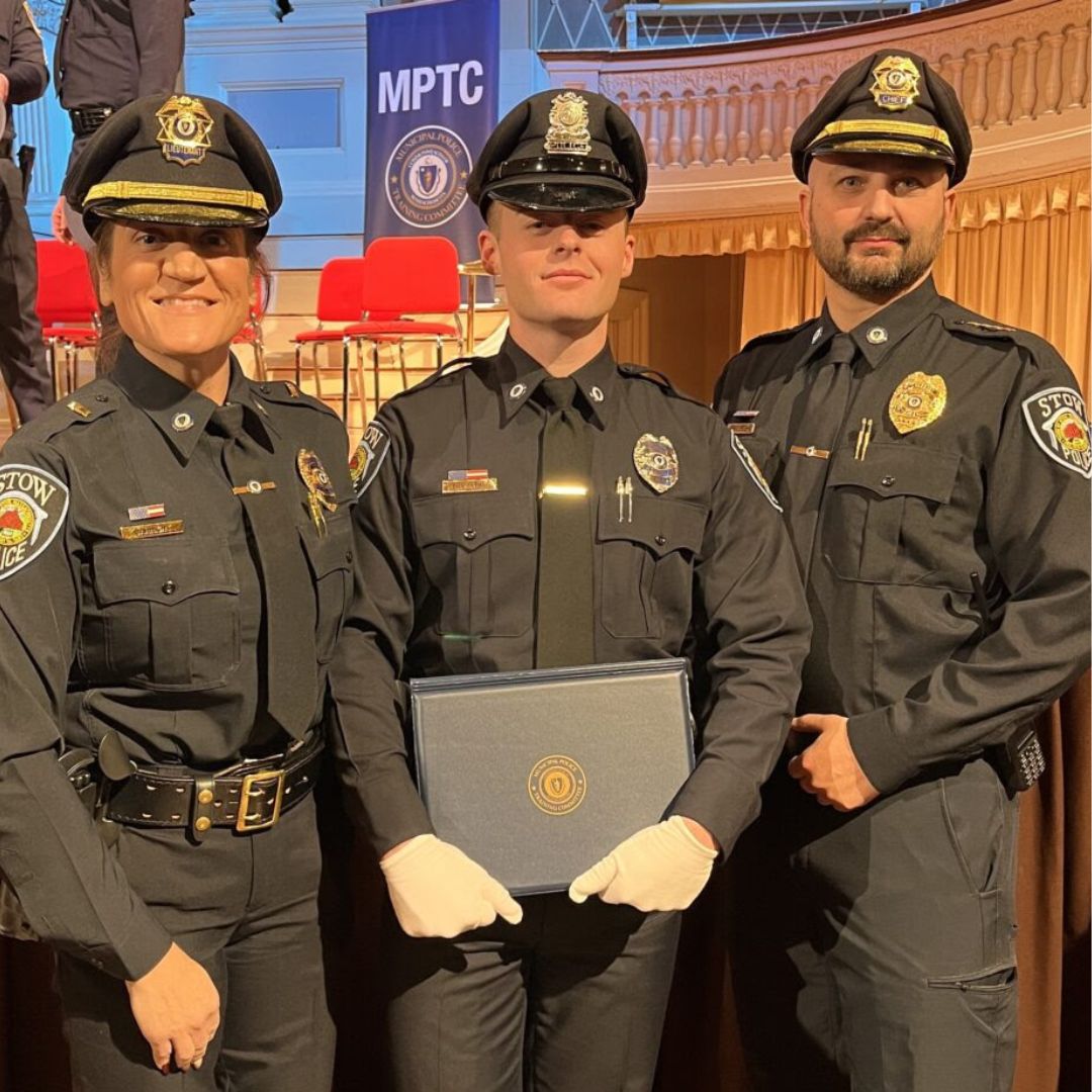 Officer Bryan McCarthy stands at his Academy graduation with Lt. Kellie Barhight on his left and Chief Michael Sallese on his right, representing the Stow Police Department.