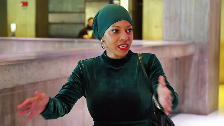 Boston City Councilor Tania Fernandes Anderson speaks at a public event, wearing a headscarf and addressing an audience. (Photo by John Tlumacki/The Boston Globe via Getty Images)