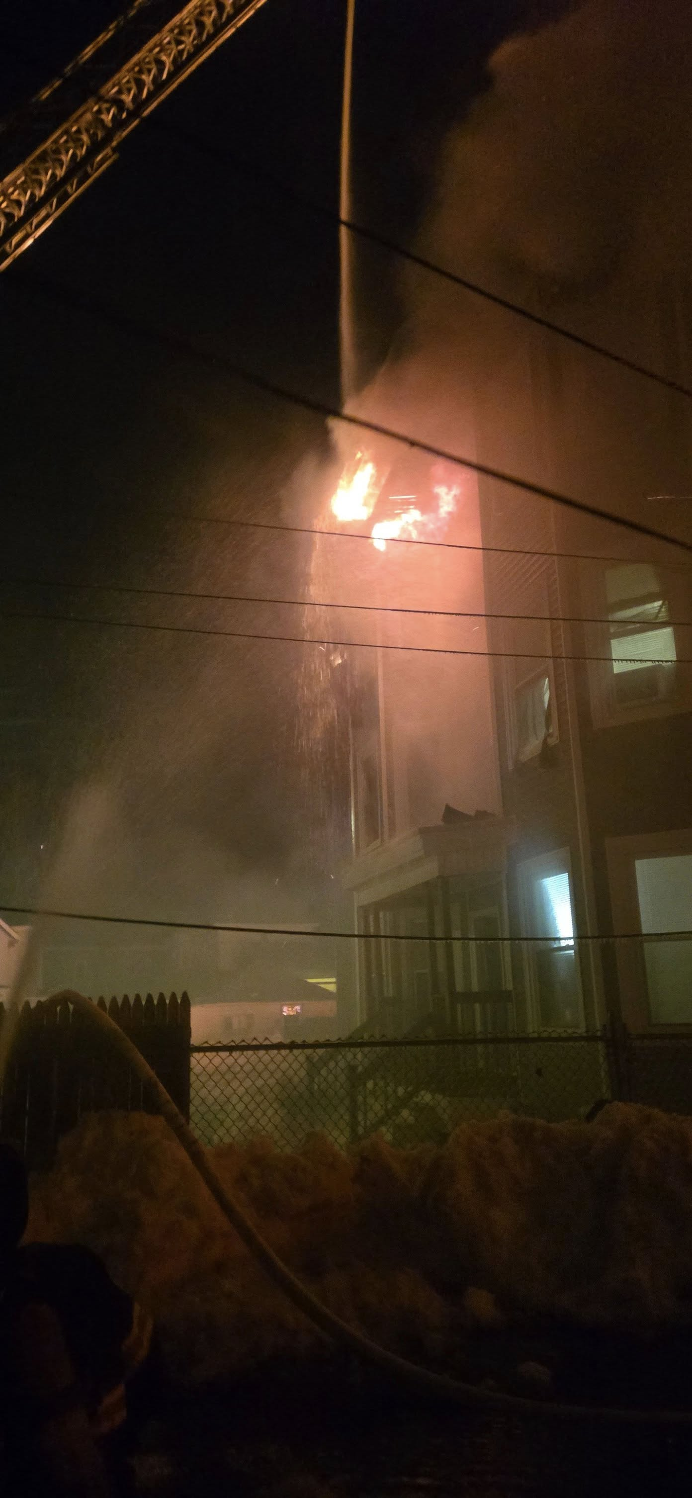 Five-alarm fire in East Lynn engulfs two buildings, firefighters remain on scene