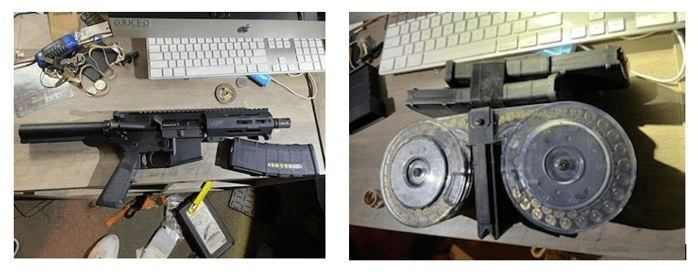 Left photo: A black ghost gun-style rifle with a magazine, lying on a desk with a computer keyboard in the background. Right Photo: A double-drum ammunition magazine resting on a desk near a keyboard.