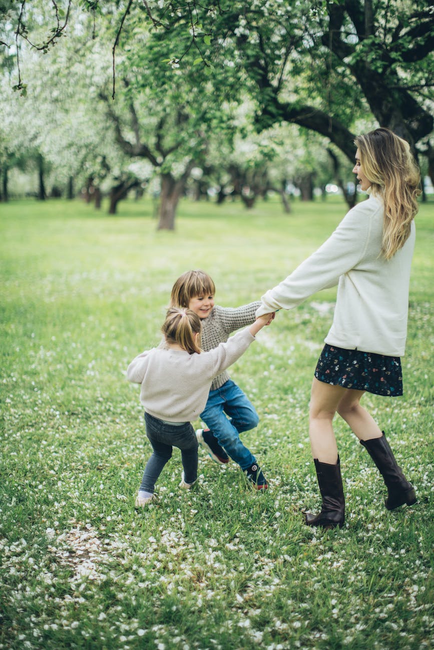 a woman playing with her daughters