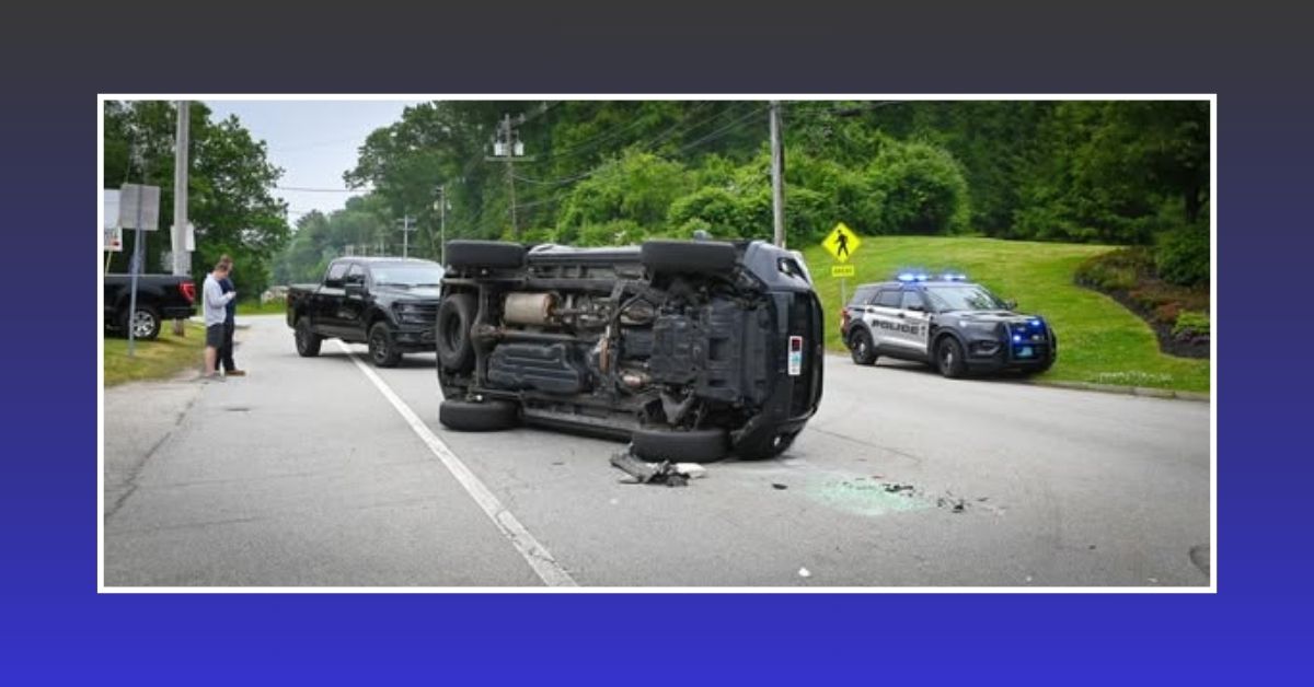 Rollover crash scene on King Street in Cohasset showing a black vehicle on its side, with a police cruiser and another vehicle nearby. Police and fire crews responded to the incident.